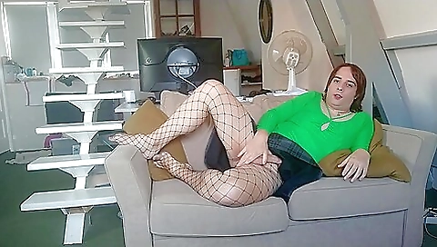 Naked redhead woman is enjoying herself on her bed