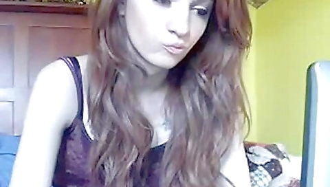 A beautiful woman with a lovely body plays with her hands